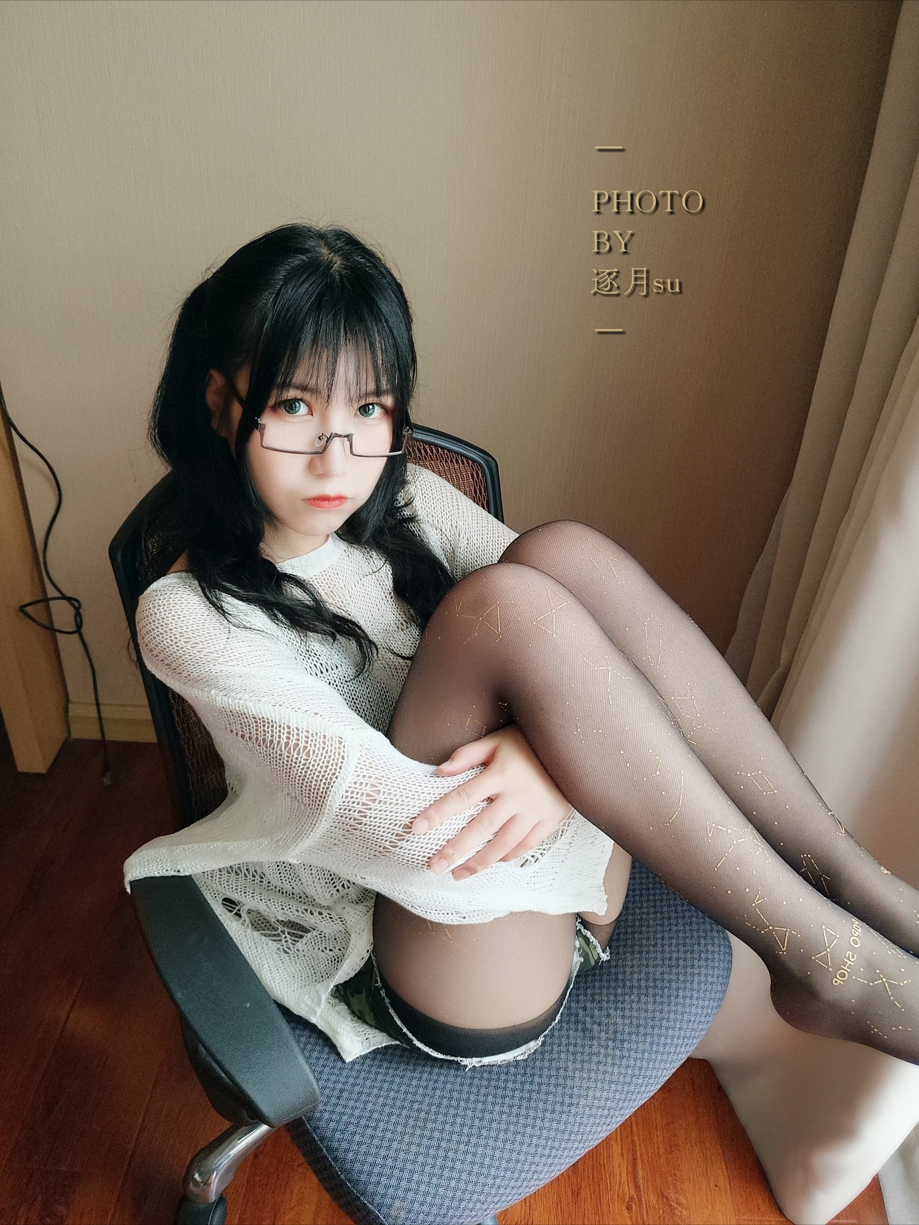 Feet posed in dark sheer stockings with slight sheen, emphasizing worn texture and sensual toe separation